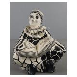 Pierrot Clown Sitting And Reading A Book Mexico