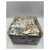 TIN OF STAMPS TO SOAK OFF PAPER MOSTLY USA AND