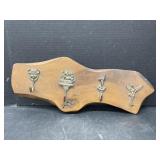 4 Metal Hooks on Wood