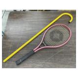 Spalding Tennis Racket And A Metal Cane