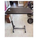 Adjustable bed side table