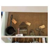 Match box, melt ladle, padlock, skeleton keys
