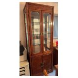 2 Thomasville lighted curio cabinets with connecting, lighted header