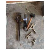 Vise grips, hitch, large pipe wrench, mallet