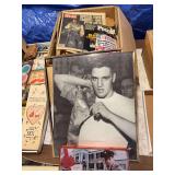 Box of Elvis newspaper clippings, poster , tin