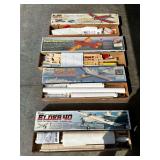 4 airplane kits: opened, one appears to be complete