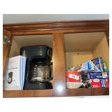 Contents in cabinet above stove