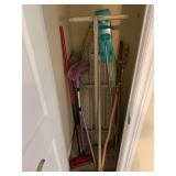Ironing board, iron, walking sticks, wood candleholder, dusters