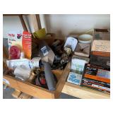 Bottom shelf of misc nails and hardware