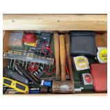 Contents of drawer: multimeter, tape measures, misc