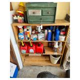 Wooden shelf with Misc oil, funnels, cleaning products, oil