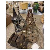 Cast iron pyramid 17.5”, pair of candle displays, lidded tin decor, wood treble clef bookends