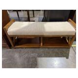 Wooden bench with cushion