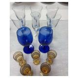 Blue stemmed wine glasses ( one rim has small chip ), 2 cobalt blue Libbey  stems, one clear Towle champagne glasses and set of 5 vintage cordials ( one has chip on rim )