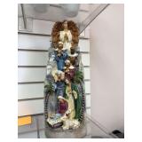 Hand painted nativity scene statue and a statue of St. Michael’s Church Charleston , S.C.