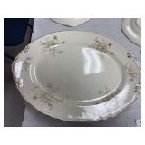 Large platter Crown Potteries Co made in USA Evansville , Ind . , smaller Crown Potteries platter, large Homer Laughlin Genesee platter, small The Harper Pottery Co platter, Lenox ware plate made in S