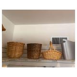 3 wicker baskets, plastic trash can