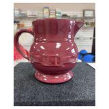Burgundy Longaberger pitcher has chip on rim