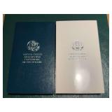 United States Eisenhower Centennial silver dollar and United States Korean war memorial coin in boxes