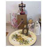 Avon Christmas carrousel , acrylic floral arrangement , Seth Thomas small gold tone clock , large floral plate , winking pink angel , small angel bell , and Goebel MJ Hummel floral Madonna ( hand has 