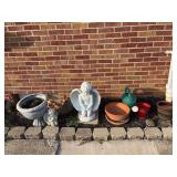 Pots, angels (small angel has broken wing ), watering can