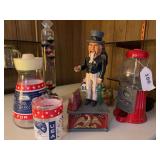 Uncle Sam mechanical bank, bubblegum machine, ring gauge, Apollo 13 glass, lighthouse ￼