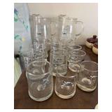 2 pitcher and glass sets of B.C. Comic Strip clear glass pitcher featuring the character Grog from the 1970s