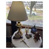 Brass lamp, battery candles, Weems & Plath clock, musical snow figure, small nativity decor, lighthouse figure, crucifix