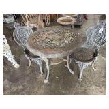 Cast iron table and 2 chairs