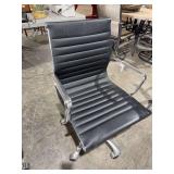 Black and chrome adjustable height rolling office chair