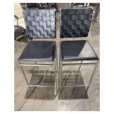 Pair of black woven back bar stools with chrome legs
