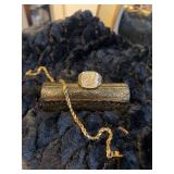 14kt gold bracelet , unmarked man’s eagle ring , and piece of gold