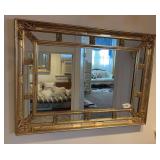 Gold framed wall mirror