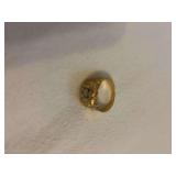 14kt man’s ring with diamond that shows what appears to be carbon specks with  loop. Has not been cleaned .