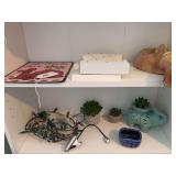 Contents of 2 shelves, tin camel sign, 2 wood “Z”’s, wood carved mask, ceramic elephant, miscellaneous