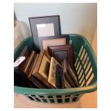 15 assorted picture frames in basket