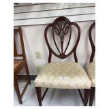 Pair of ornate backed chairs with some stains noted on seats