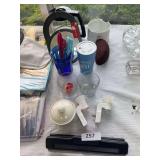 Paper punch, mirror, eye glass case, scissors. Plug ins, misc