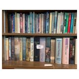 Bottom 2 shelves of books