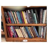 Bottom 2 shelves of books