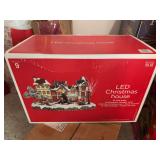 Lot of Christmas items: animated Snoopy, electric candles, wood windmill, plastic Charlie Brown, LED Christmas house, nativity, misc