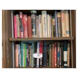 Bottom 2 shelves of books