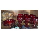 Red goblets, hobnail dish. Clear glass wines