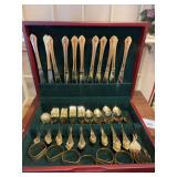 Stainless gold tone flatware in wood chest