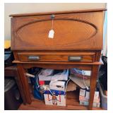 vintage Art Deco-style wooden drop-front secretary desk or storage cabinet with a distinctive waterfall edge and chevron-patterned wood veneer. Nothing included  43” h x 34” w x 17” d
