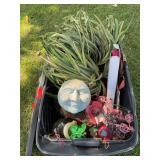 Tub of outdoor misc: humming bird feeder, artificial plant, pink flamingo lights,