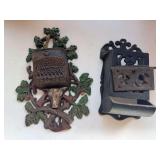 2 cast iron match holders