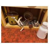 vintage Wear-Ever Aluminum Hand Press Citrus Squeezer, a mid-century cast aluminum kitchen tool designed for extracting juice from citrus fruits. , vintage aluminum cone sieve and strainer with a wood