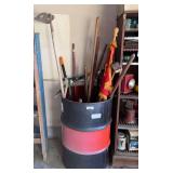 Metal barrel with lawn tools