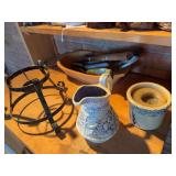 Metal stand, blue and white pitcher, garden hand shovels, hammer, candle